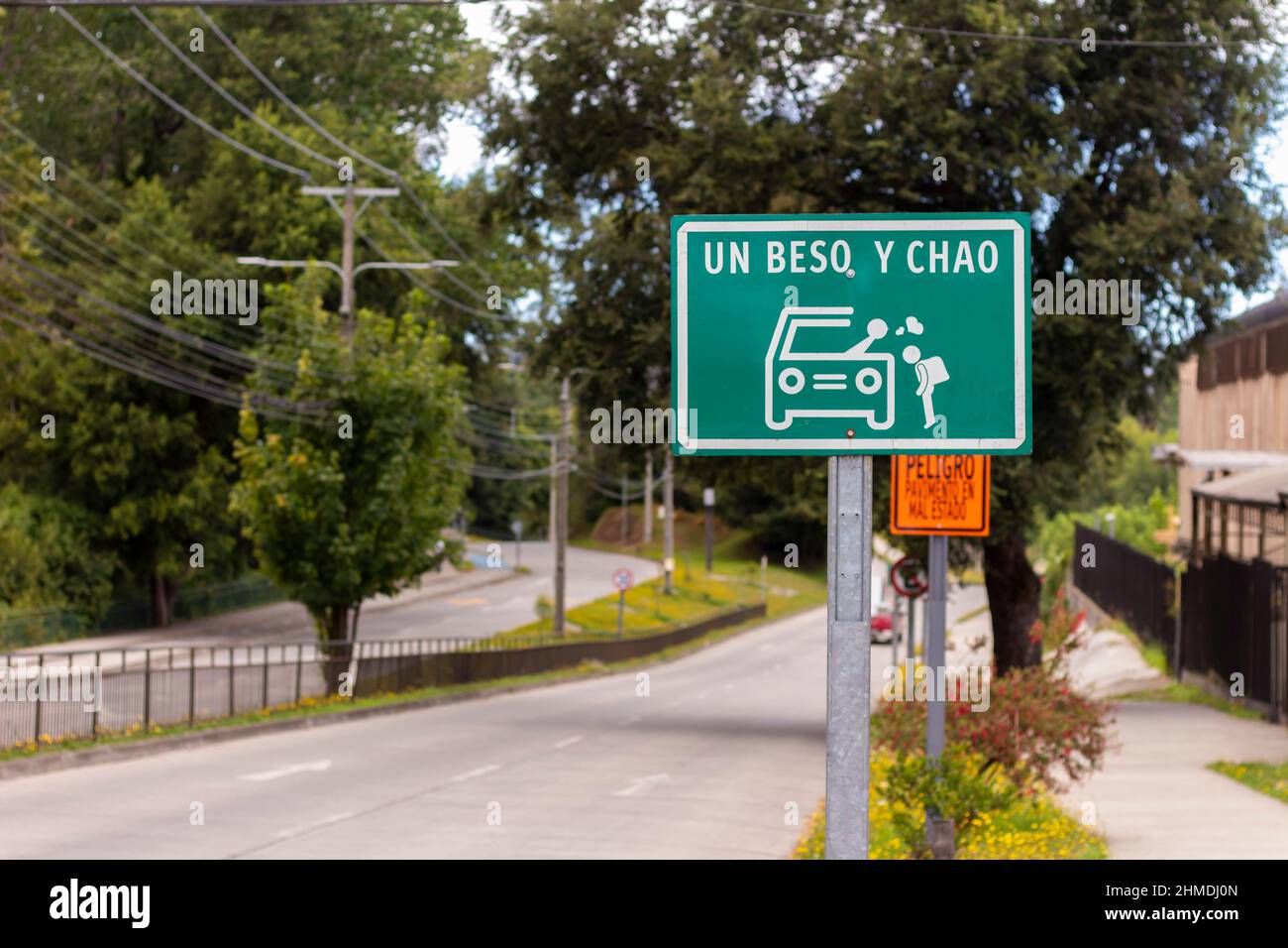 A kiss and goodbye road sign near a school on Valdivia, Chile Stock Photo
