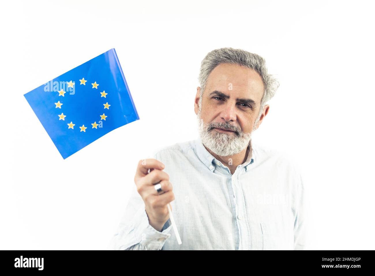 Middle-aged enterprenuer waving an EU flag - isolated white background. High quality photo Stock Photo