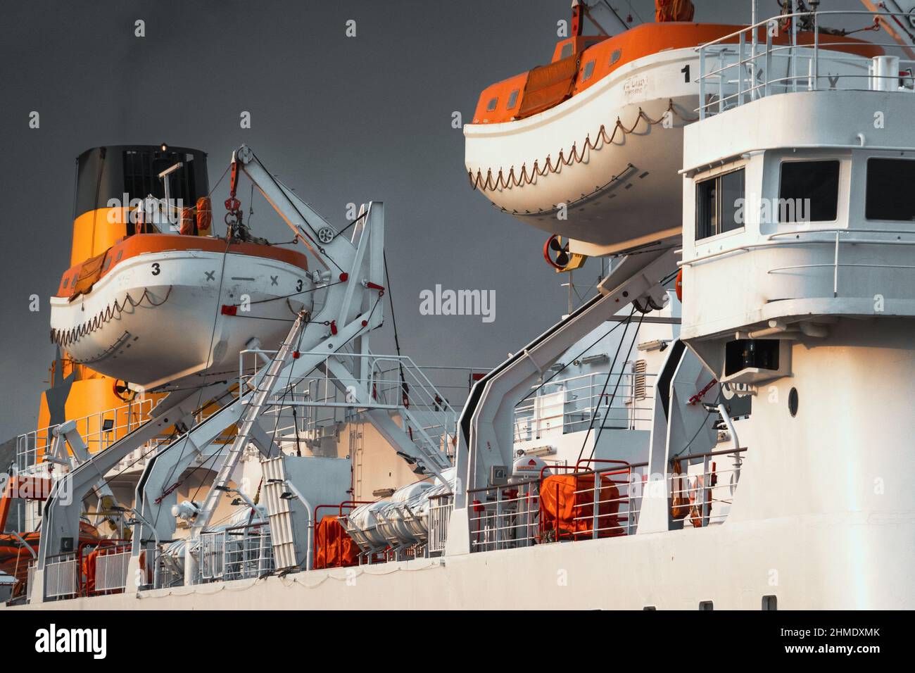 Rescue boats hanged on big passenger cruise ship Stock Photo