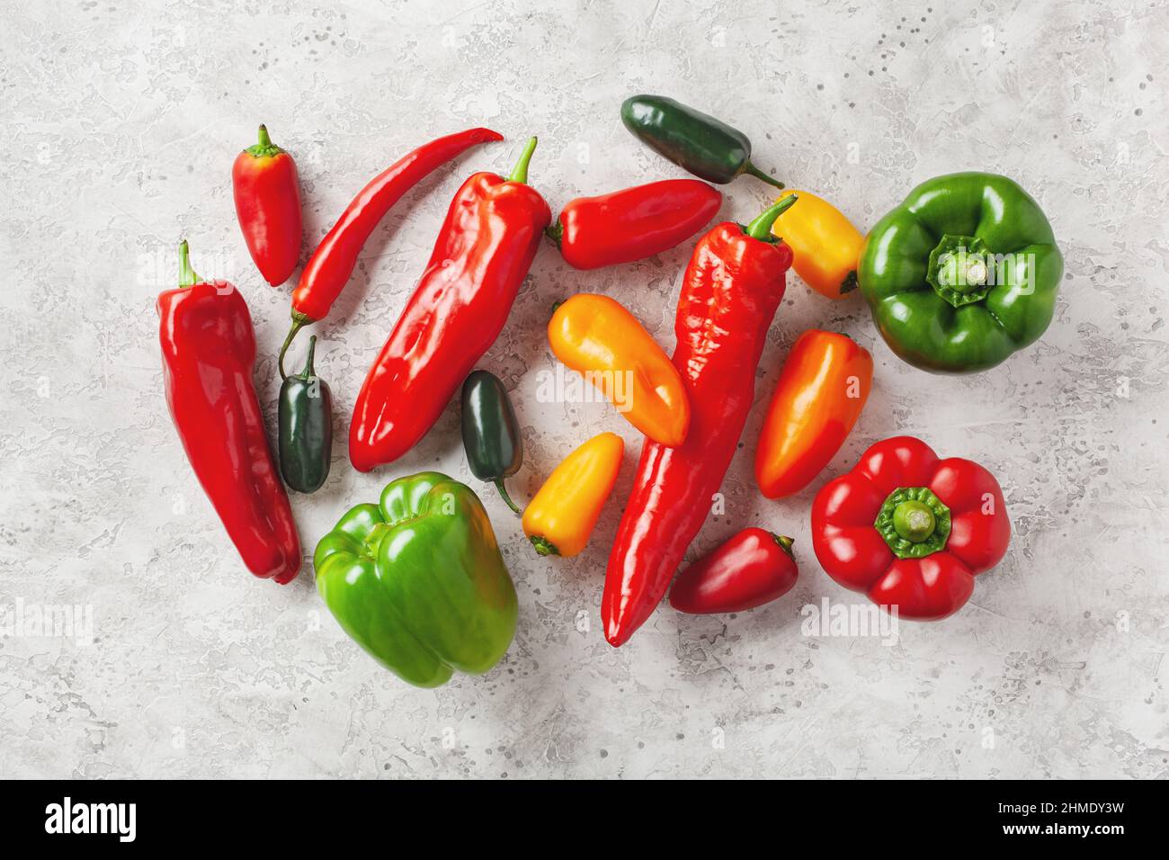 assorted red green and yellow bell peppers vegetables chili habanero Stock Photo