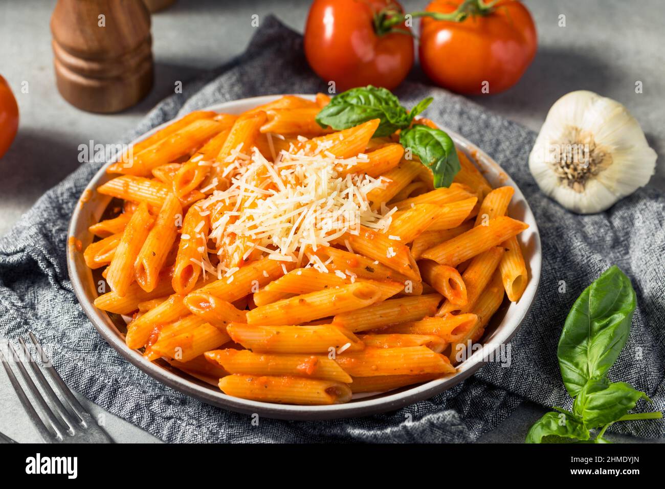 Homemade Penne Pasta with Marinara Sauce Cheese and Basil Stock Photo