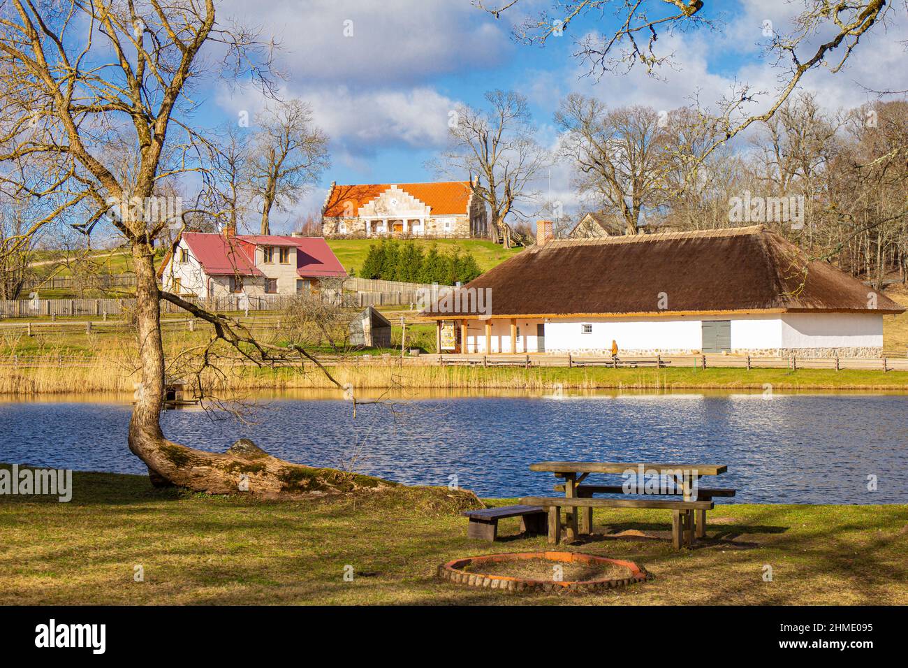 Beautiful view to Old village House at the lake bank in autumn. Countryside landscape near a famous Latvian resort Sigulda, Latvia, Vidzeme Region, Pi Stock Photo