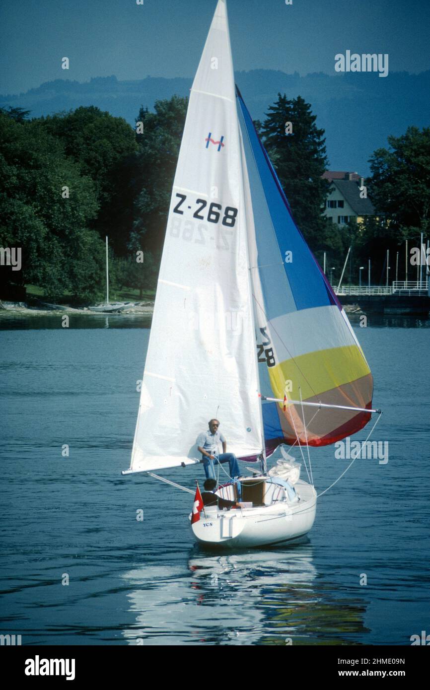 Couple sailing small yacht on Lake Constance in 1981, Wasserburg, Bavaria, Germany Stock Photo