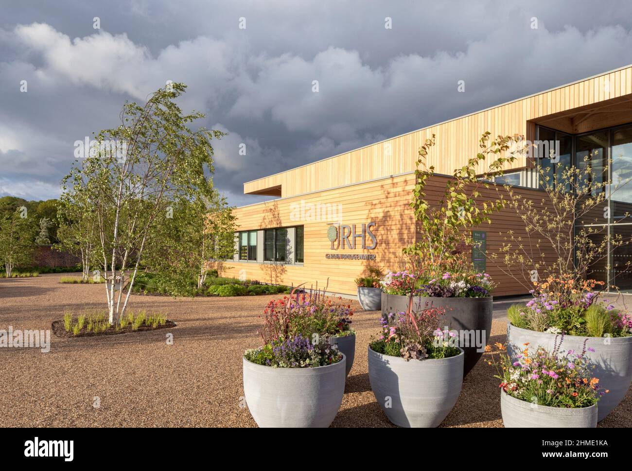 Entrance with plant pots. Royal Horticultural Society Visitor Centre, Worsley, Salford, United Kingdom. Architect: Hodder & Partners, 2021. Stock Photo