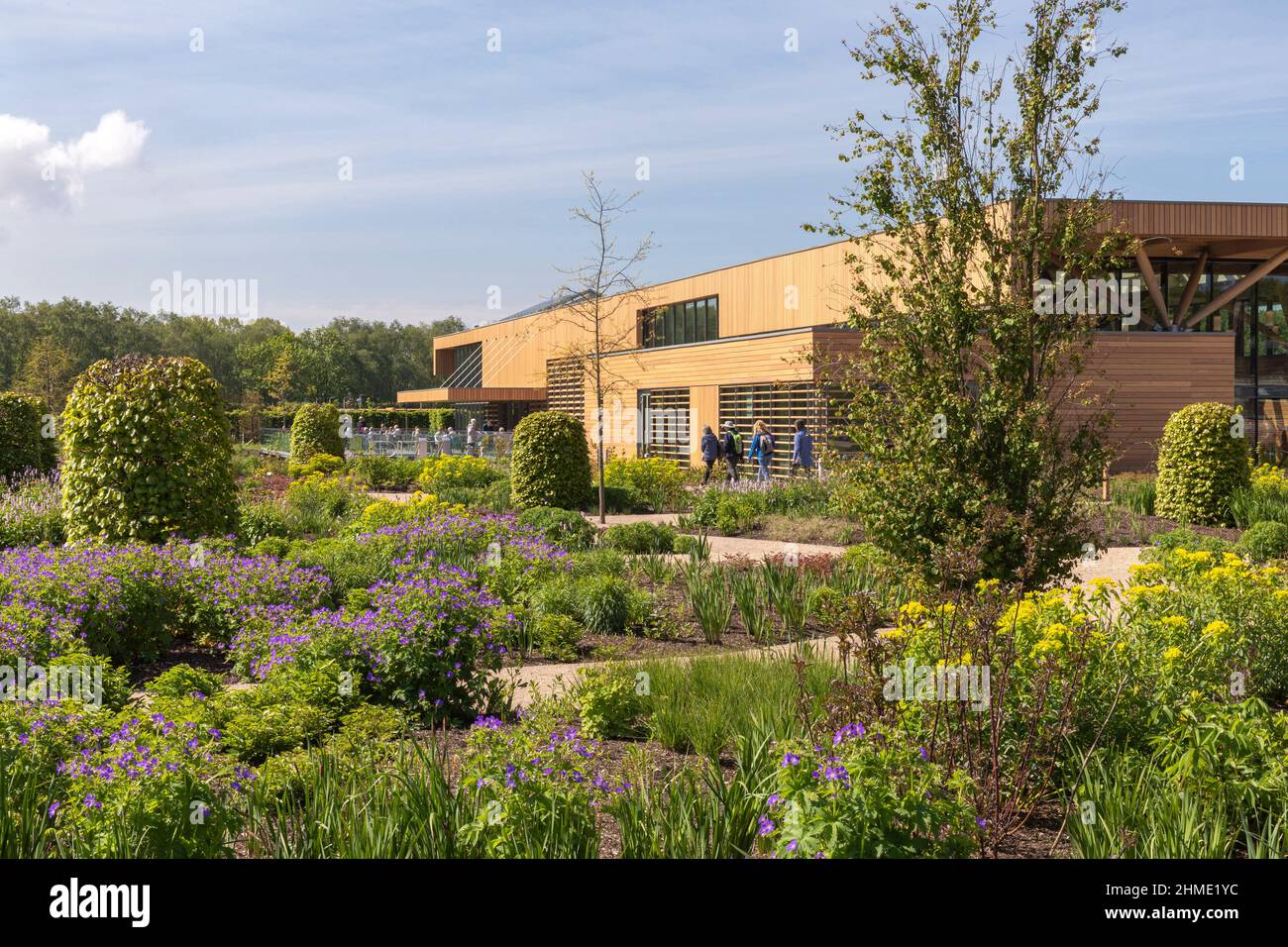 View to southeast through gardens. Royal Horticultural Society Visitor Centre, Worsley, Salford, United Kingdom. Architect: Hodder & Partners, 2021. Stock Photo