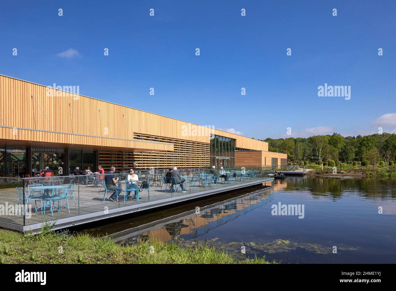 Outdoor café area seating platform from the southeast. Royal Horticultural Society Visitor Centre, Worsley, Salford, United Kingdom. Architect: Hodder Stock Photo