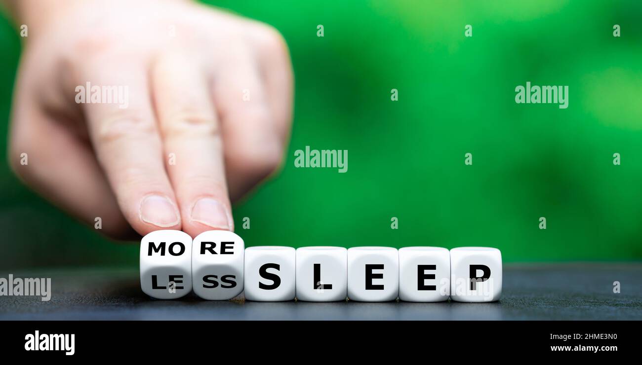 Hand turns dice and changes the expression "less sleep" to "more sleep