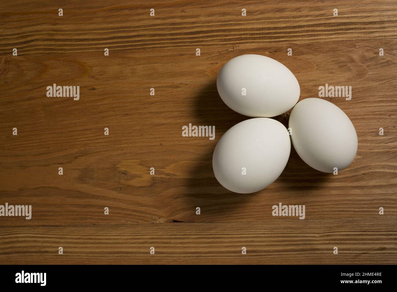 Eggs on wooden background Stock Photo - Alamy