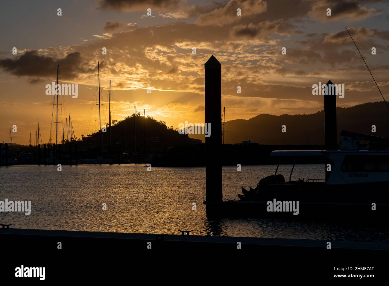 Sunset at Airlie Marina. Sailing holiday in Whitsundays Australia. Whitsunday Islands, Queensland. Stock Photo