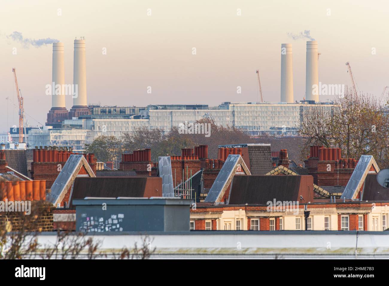 Steam rising from Rebuilt Chimneys of The Battersea Power Station Development. London. Photographed from Chelsea. Stock Photo