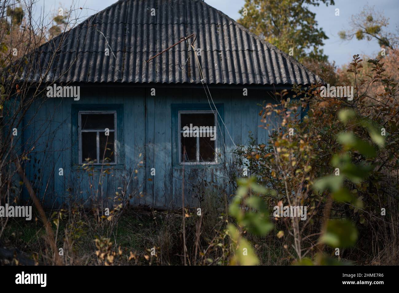 Abandoned homes in the village of Kupovate, in the exclusion zone near the Chernobyl Nuclear Power Plant were once lived in by resettlers. Stock Photo