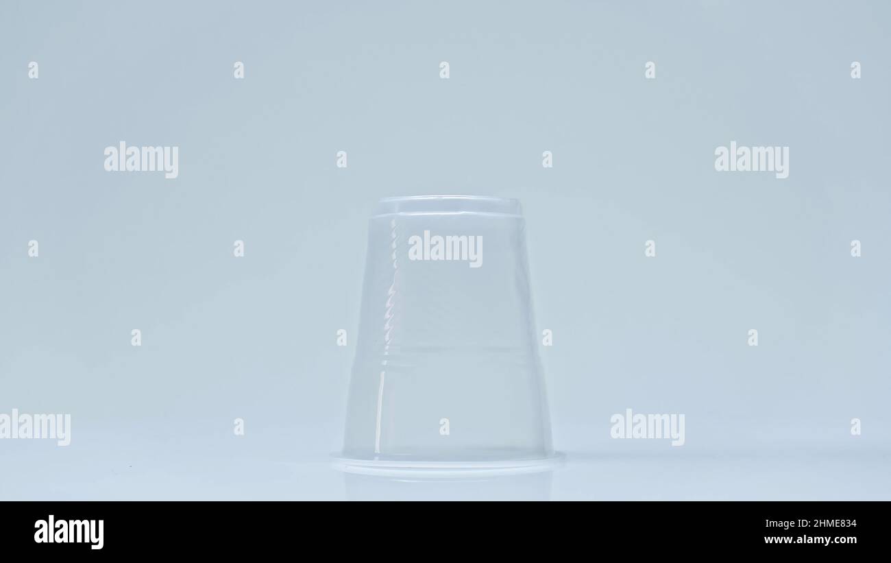 plastic cup on grey background with copy space, environmental concept ...