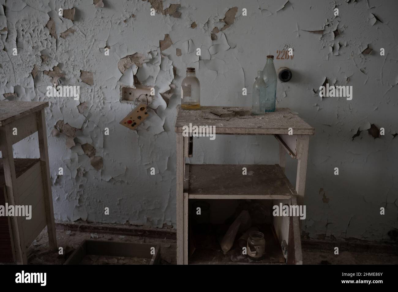 A large assortment of medicine, furniture and medical equipment remains decaying in the hospital in Pripyat, Ukraine near the Chernobyl Nuclear Plant. Stock Photo