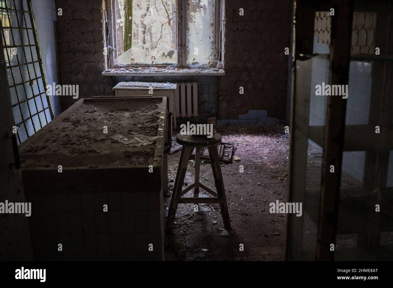The autopsy table in the abandoned morgue in Pripyat, Ukraine near the Chernobyl Nuclear Power Plant. Stock Photo