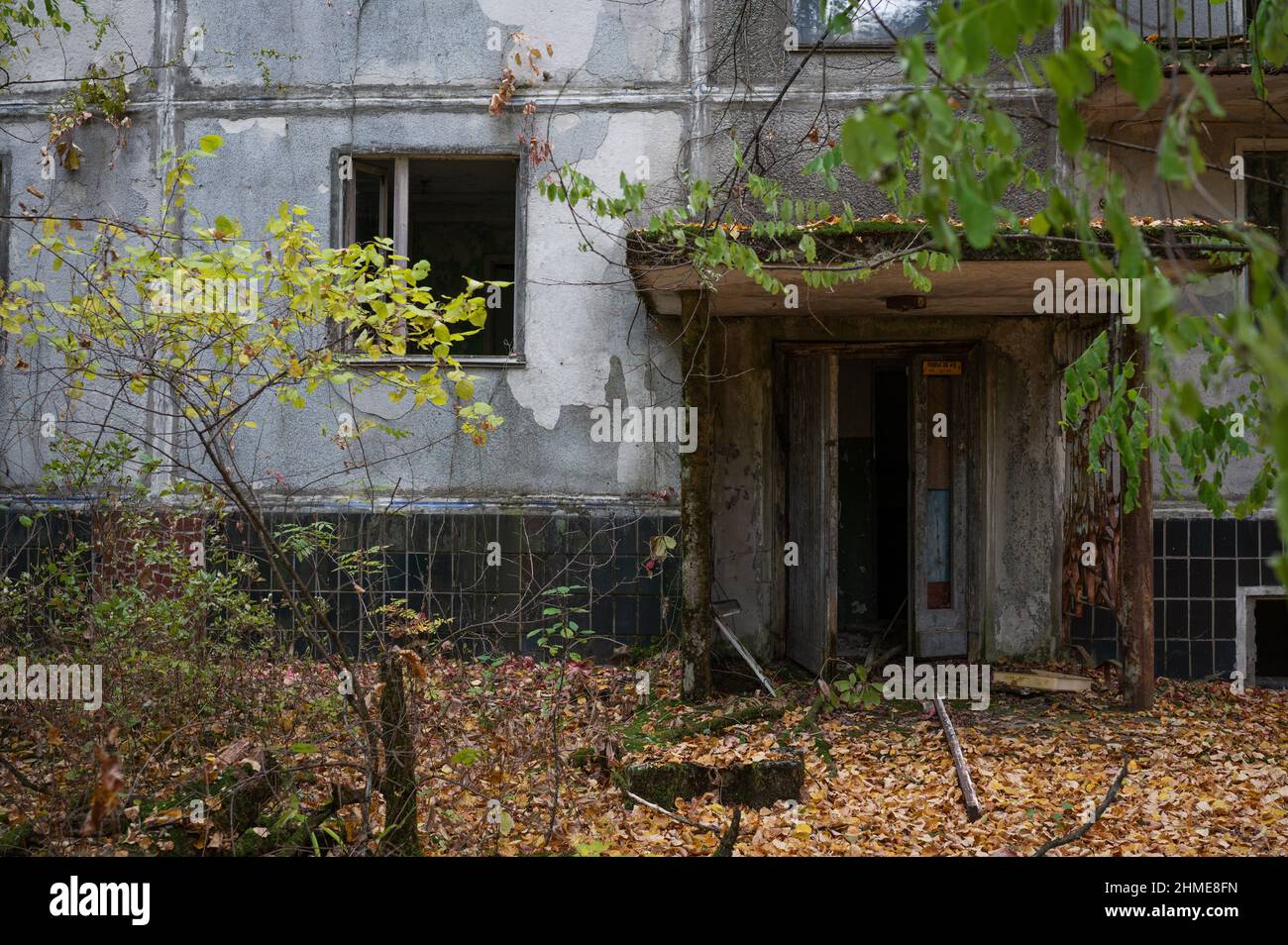 Abandoned apartment buildings in Pripyat, Ukraine, near the Chernobyl Nuclear Power Plant, are slowly crumbling and being claimed by nature. Stock Photo