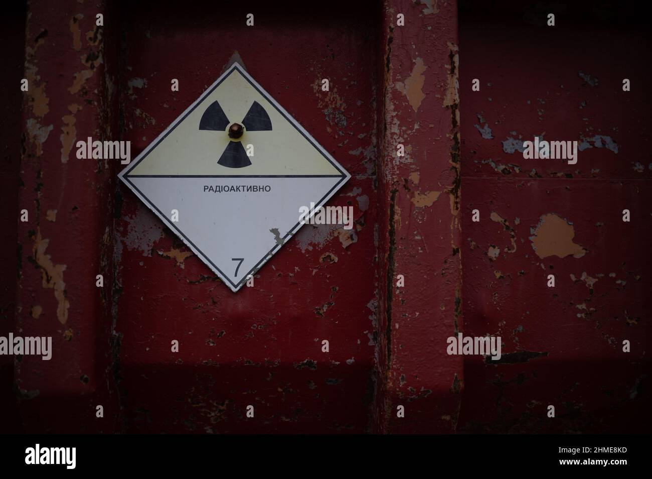 A classic radioactive warning sign on the door of a truck in the vehicle graveyard in Pripyat, Ukraine near the Chernobyl Nuclear Power Plant. Stock Photo