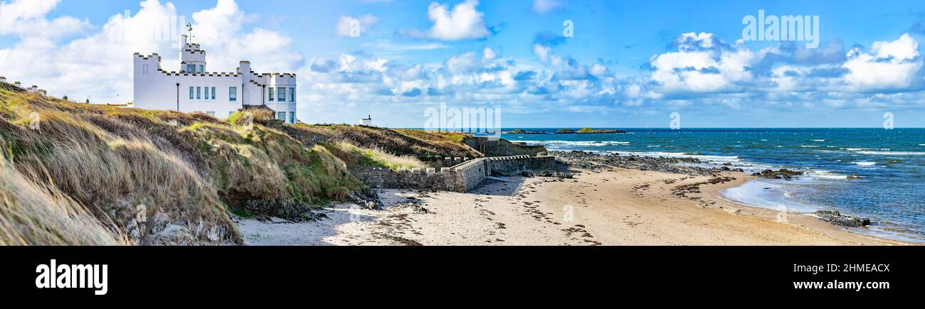 Surf Point (Sausage Point), a romantic beach front castellated seaside 'folly' style holiday home in Rhosneigr, Anglesey, North Wales, UK Stock Photo
