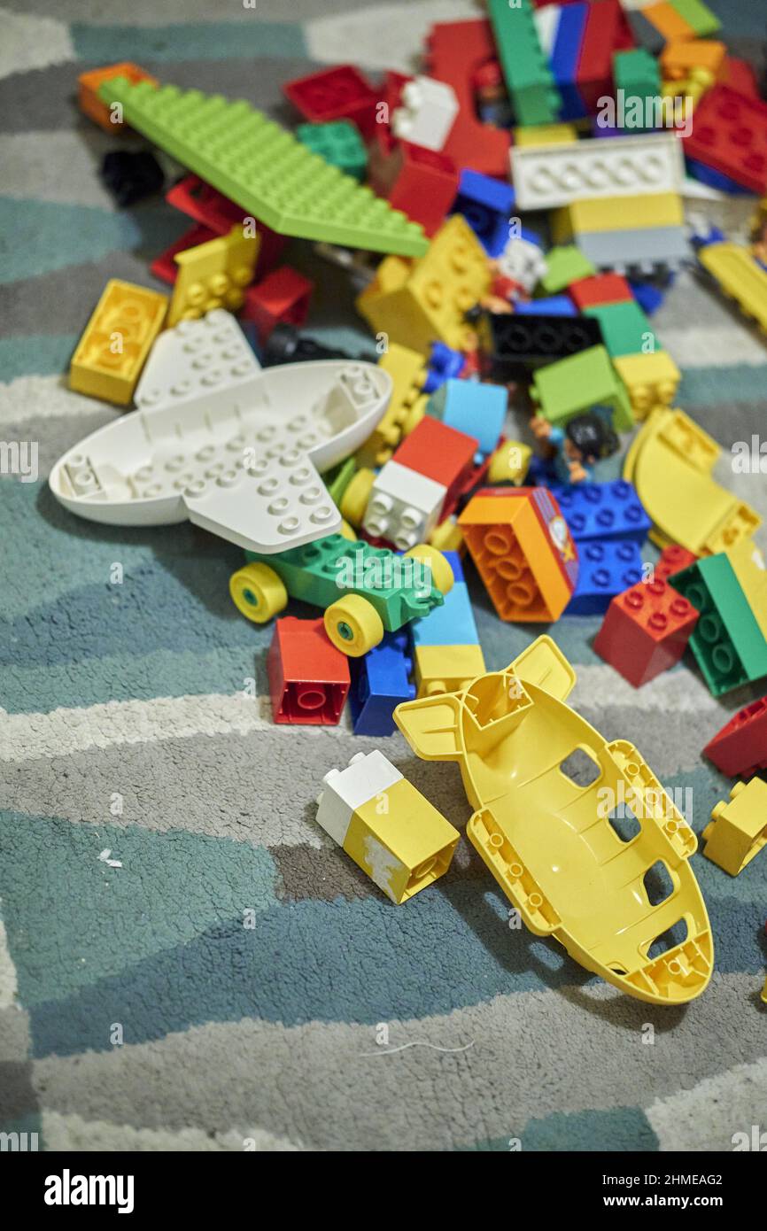 Mix of colorful Lego Duplo bricks laying on a carpet floor Stock Photo -  Alamy