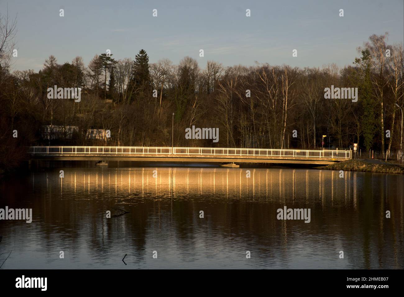 Golden lit bridge by the Sun Stock Photo