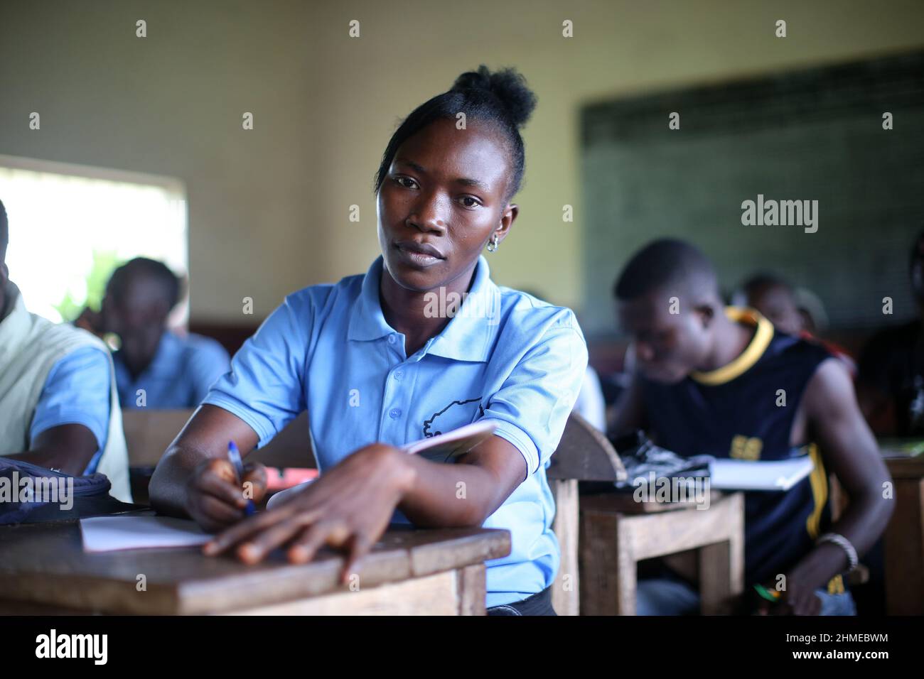 School children and young adults learn trades at an NGO funded vocational and technical school in Sierra Leone. Stock Photo