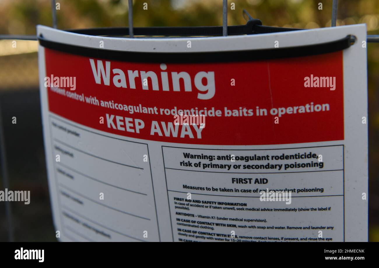 A warning sign for anticoagulant rodenticide baiting in operation in the inner city area of Southampton UK. protection from poisoning. Stock Photo