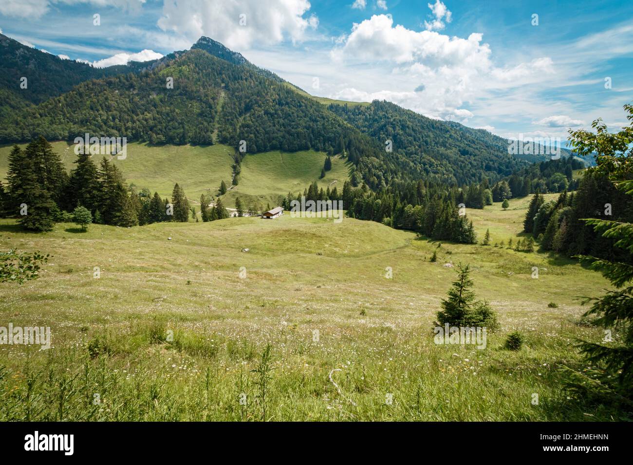 Peaceful mountain landscape with clear blue sky and white clouds hi-res ...