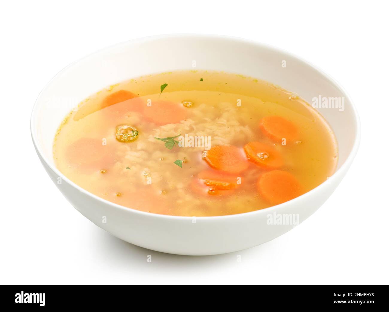bowl of chicken broth soup with vegetables and rice isolated on white background Stock Photo Alamy