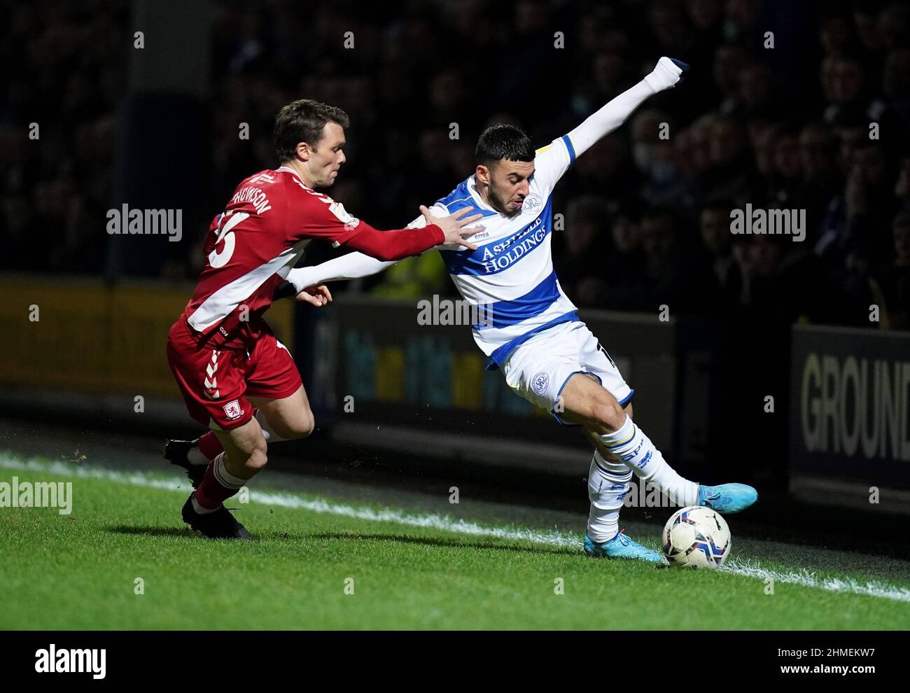 Middlesbrough's Jonny Howson (left) and Queens Park Rangers' Ilias Chair battle for the ball during the Sky Bet Championship match at the Kiyan Prince Foundation Stadium, London. Picture date: Wednesday February 9, 2022. Stock Photo