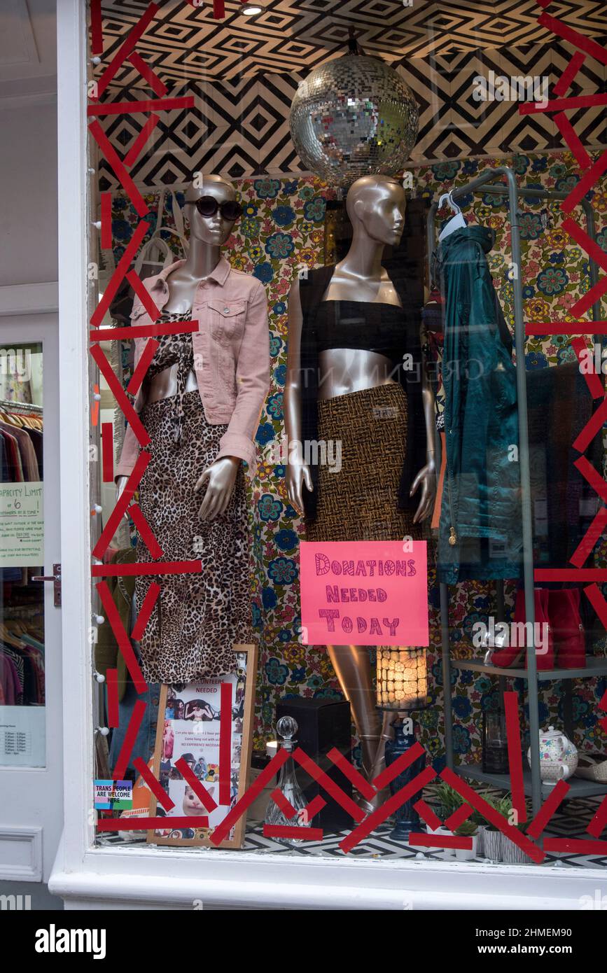 Mannequins in the window of a charity shop on Nicolson Street, Edinburgh, Scotland, UK. Stock Photo