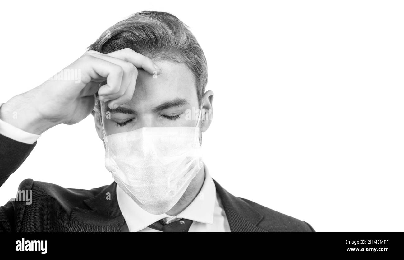 businessman in respirator has headache. covid19 prevention. tired man in mask during coronavirus Stock Photo