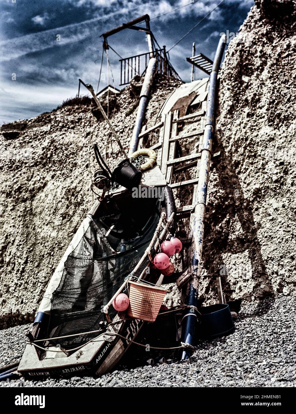 Arty print ready intimate landscape of boat and ladder on the crumbling ...