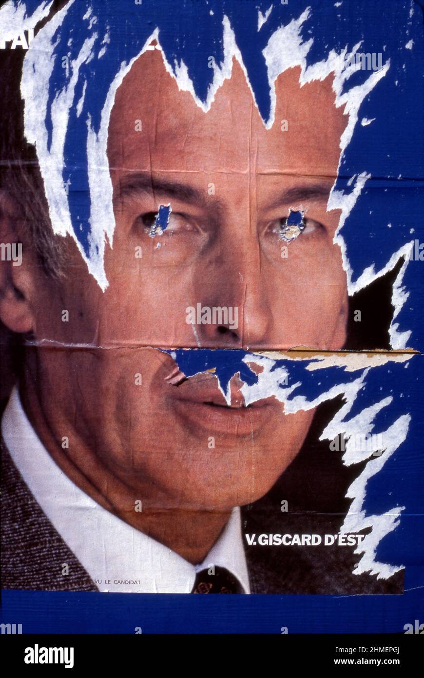 Torn poster of French President Valery Giscard D'Estaing on street in Paris, France circa 1981 Stock Photo