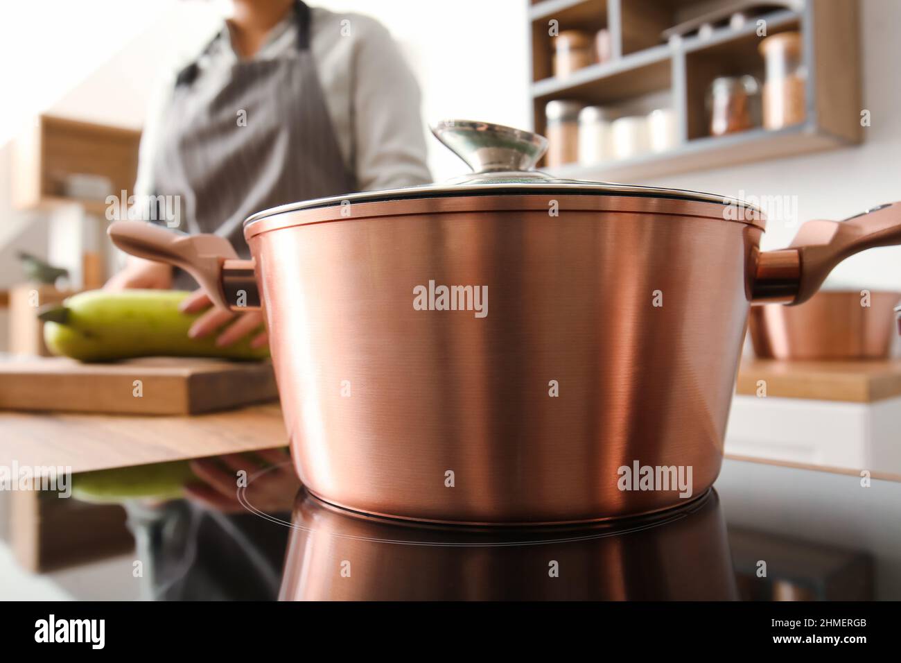https://c8.alamy.com/comp/2HMERGB/big-cooking-pot-on-stove-in-kitchen-closeup-2HMERGB.jpg