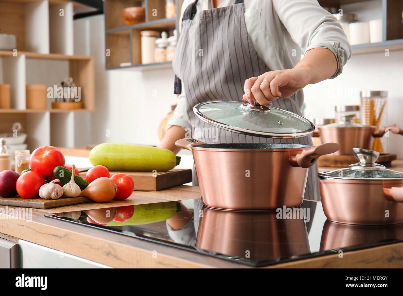 Person cooking pot food lid hi-res stock photography and images - Alamy