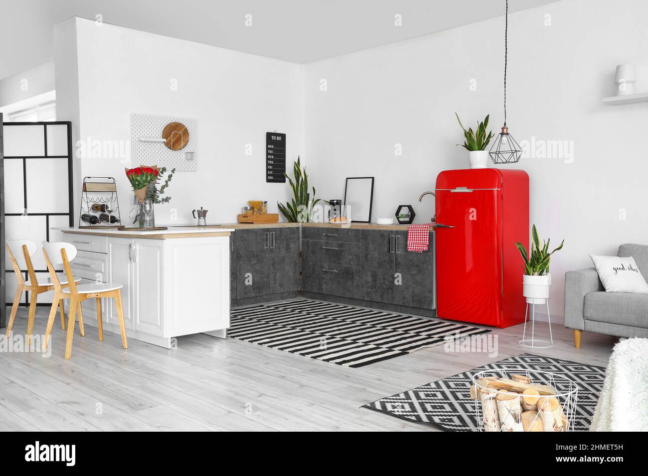 Interior of modern kitchen with counters and red fridge Stock Photo - Alamy