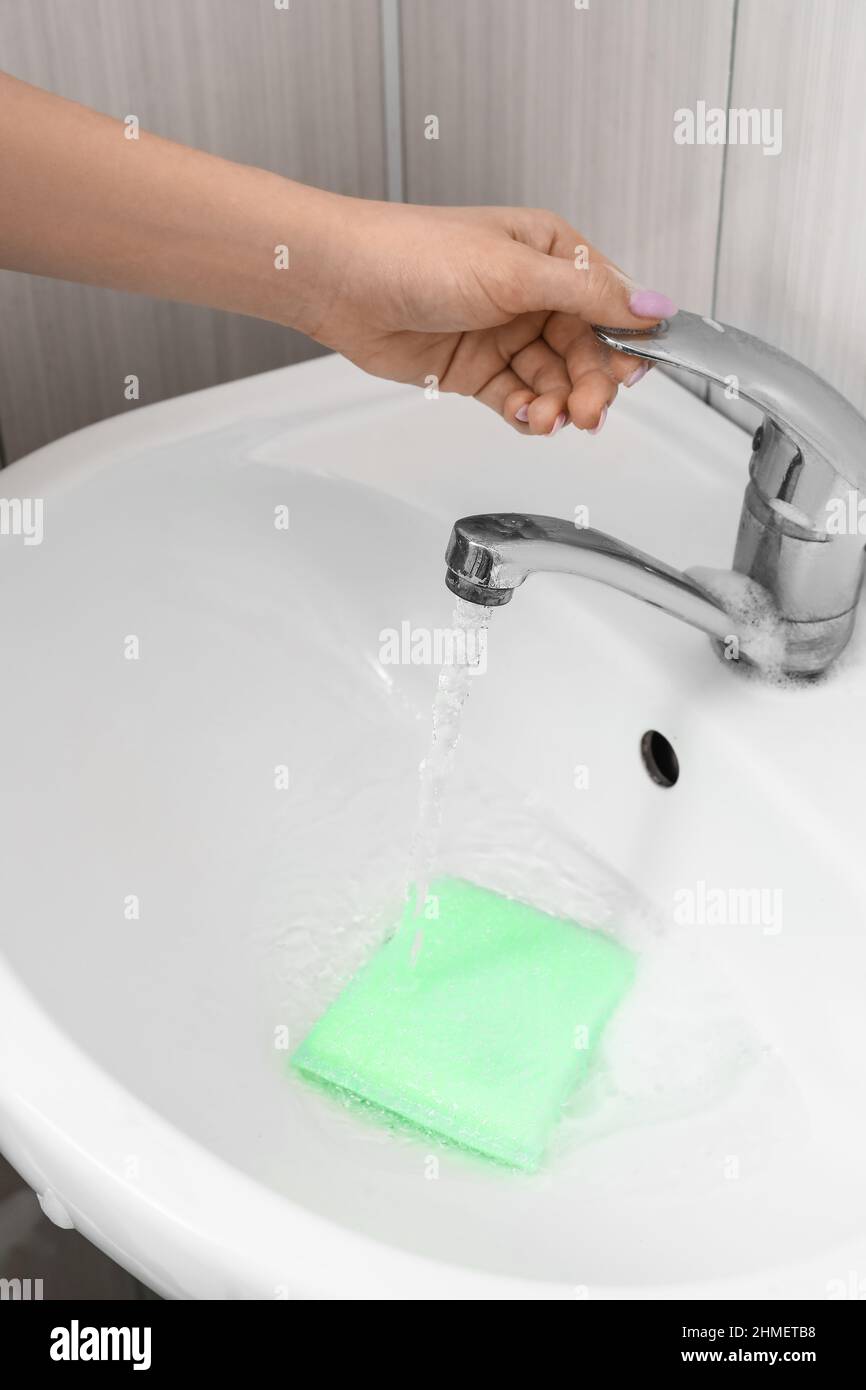 Hand turning off faucet hires stock photography and images Alamy