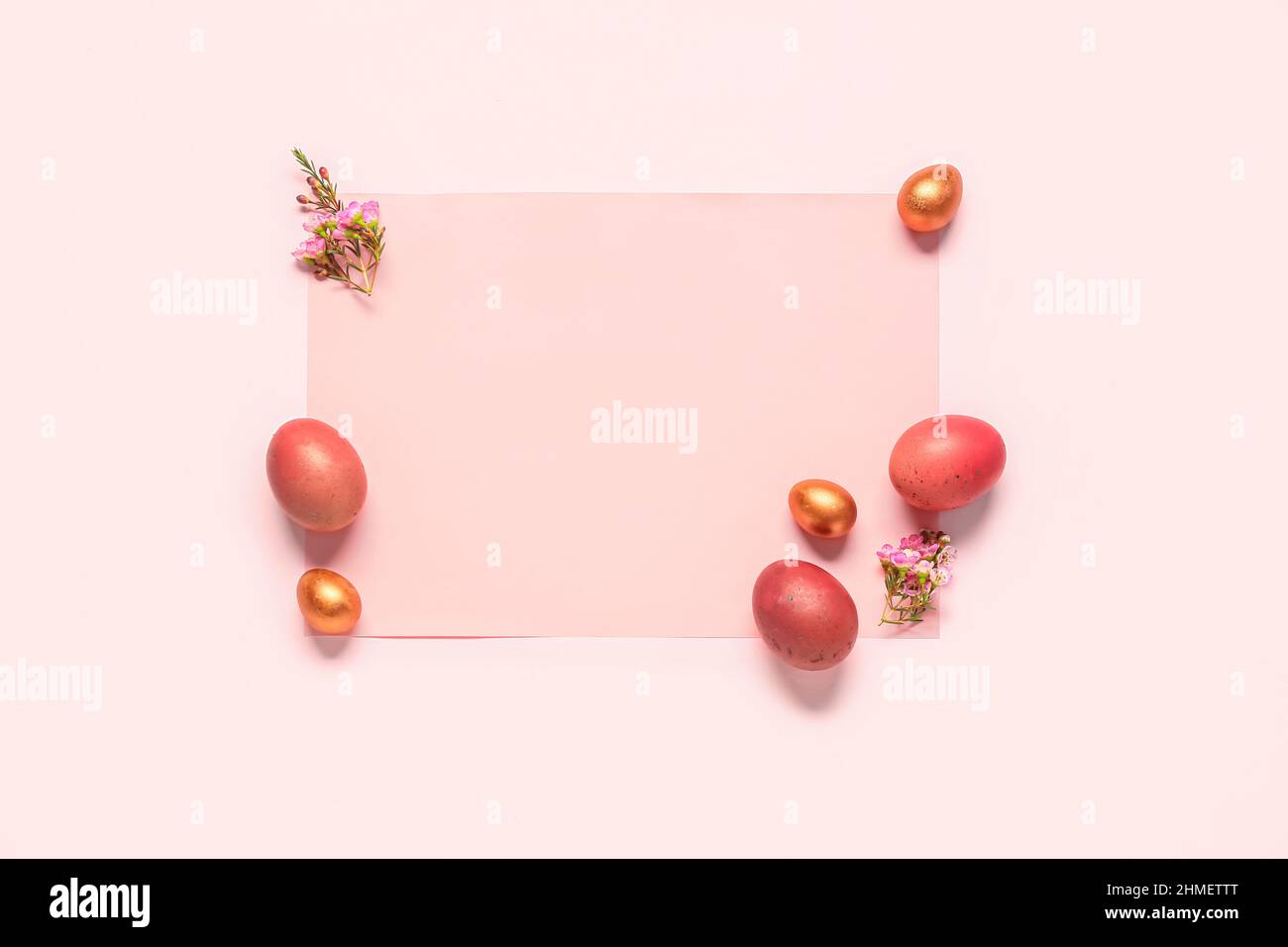 Beautiful composition with sheet of paper, Easter eggs and flowers on ...