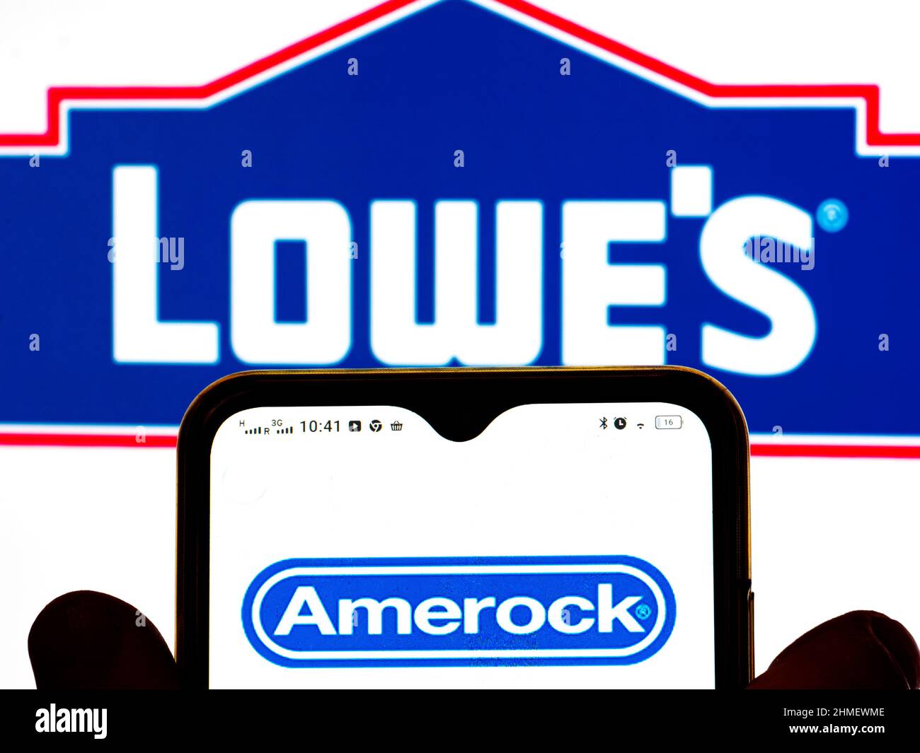 Ukraine. 9th Feb, 2022. In this photo illustration, the Amerock logo is displayed on a smartphone screen and a Lowe's Companies, Inc. logo in the background. (Credit Image: © Igor Golovniov/SOPA Images via ZUMA Press Wire) Stock Photo