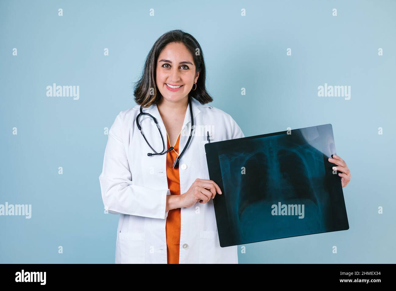 hispanic woman doctor looks at xray radiography images in radiology ...