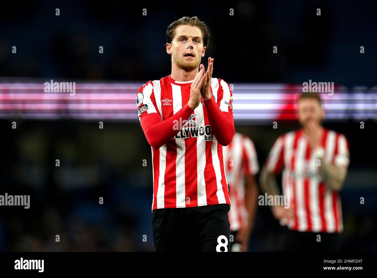 Brentford's Mathias Jensen applauds the fans after during the Premier League match at the Etihad Stadium, Manchester. Picture date: Wednesday February 9, 2022. Stock Photo
