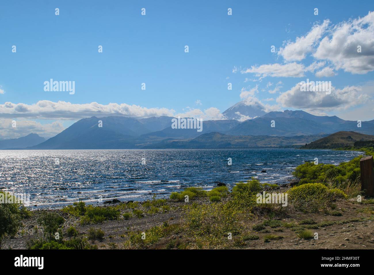 Huechulafquen Lake in the Patagonian Andes, mountain range with the Lanin volcano in the background. Stock Photo