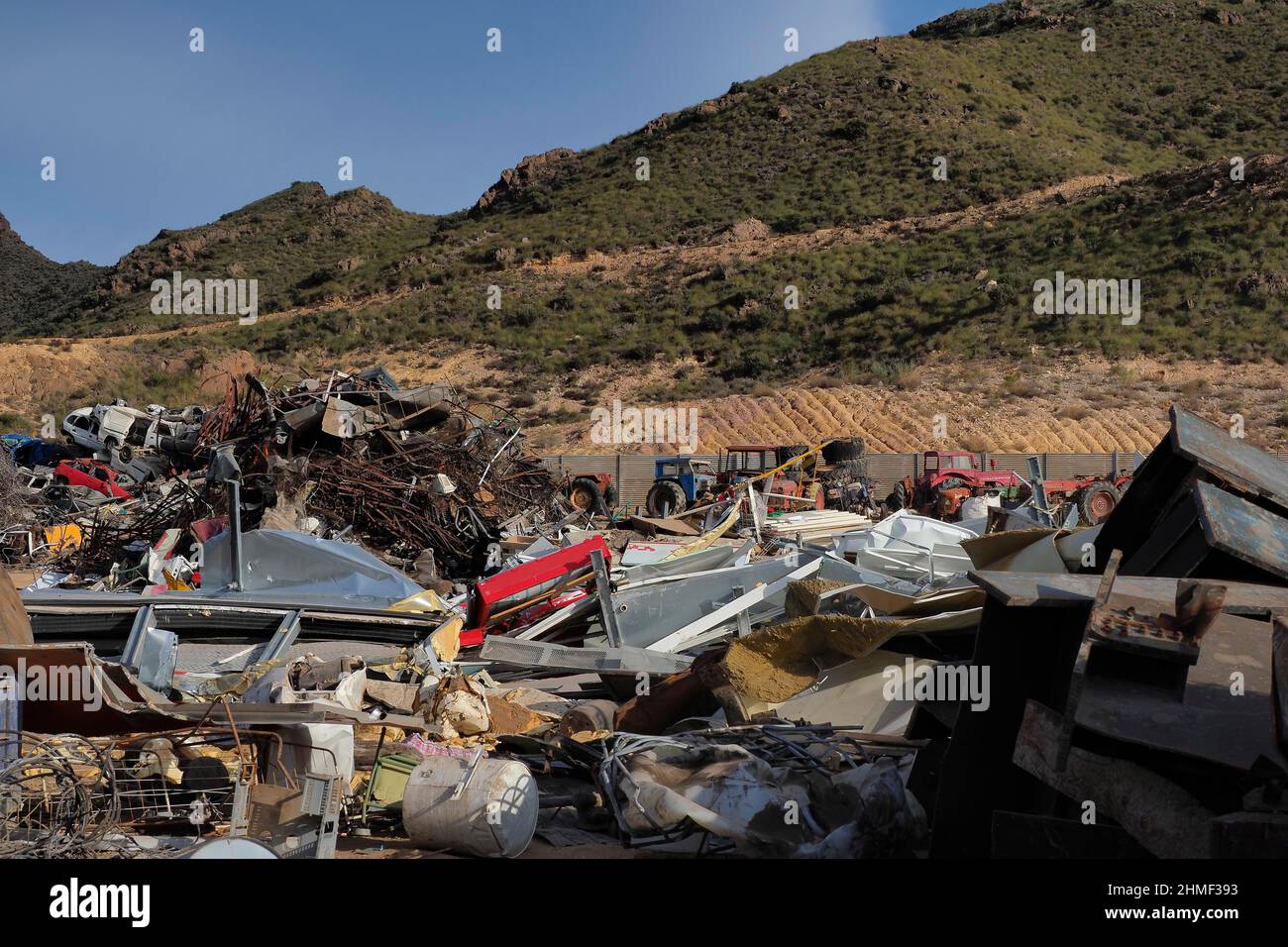 Scrap Yard In Hilly Landscape Crushed Metal Aluminium Blocks Scrap scrap-yard-in-hilly-landscape-crushed-metal-aluminium-blocks-scrap