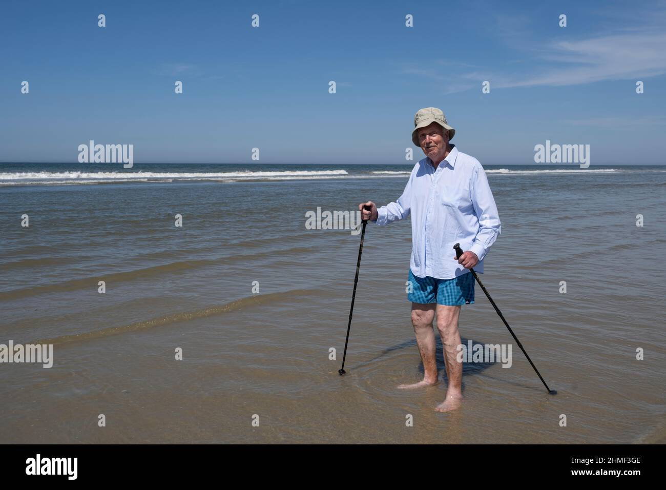 Older man walking on the beach, Juist Island, North Sea, East Frisia, Lower Saxony, Germany Stock Photo