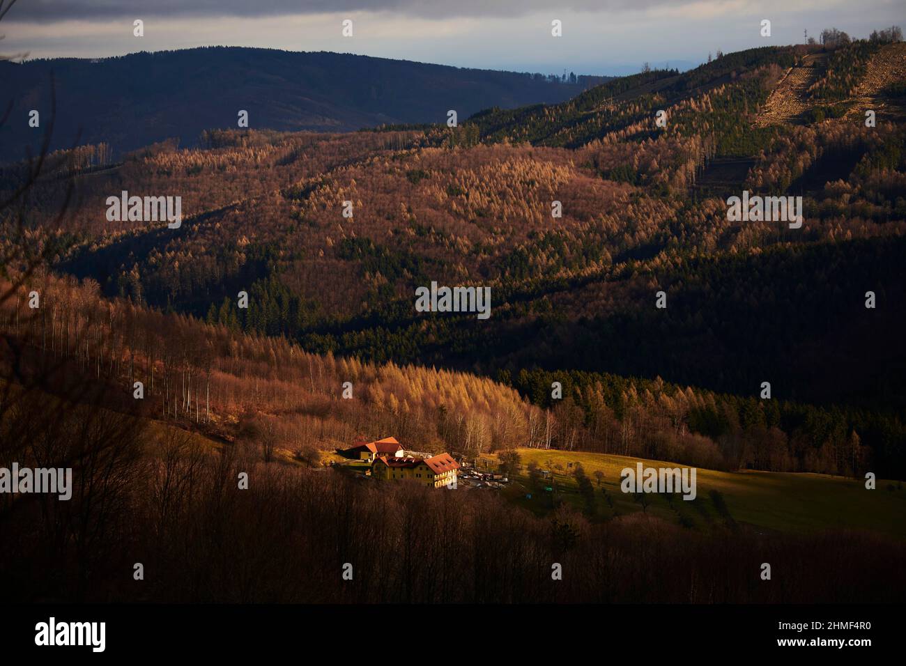 Spotlight from the sunon a small farm, Kleine Fatra, Carpathian Mountains, border, Czech Republick, Slovakia Stock Photo