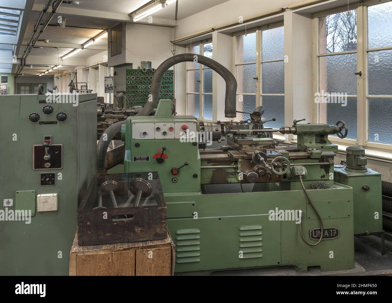 Lathe with extraction system in a former valve factory, now an industrial museum, Lauf an der Pegnitz, Middle Franconia, Bavaria, Germany Stock Photo