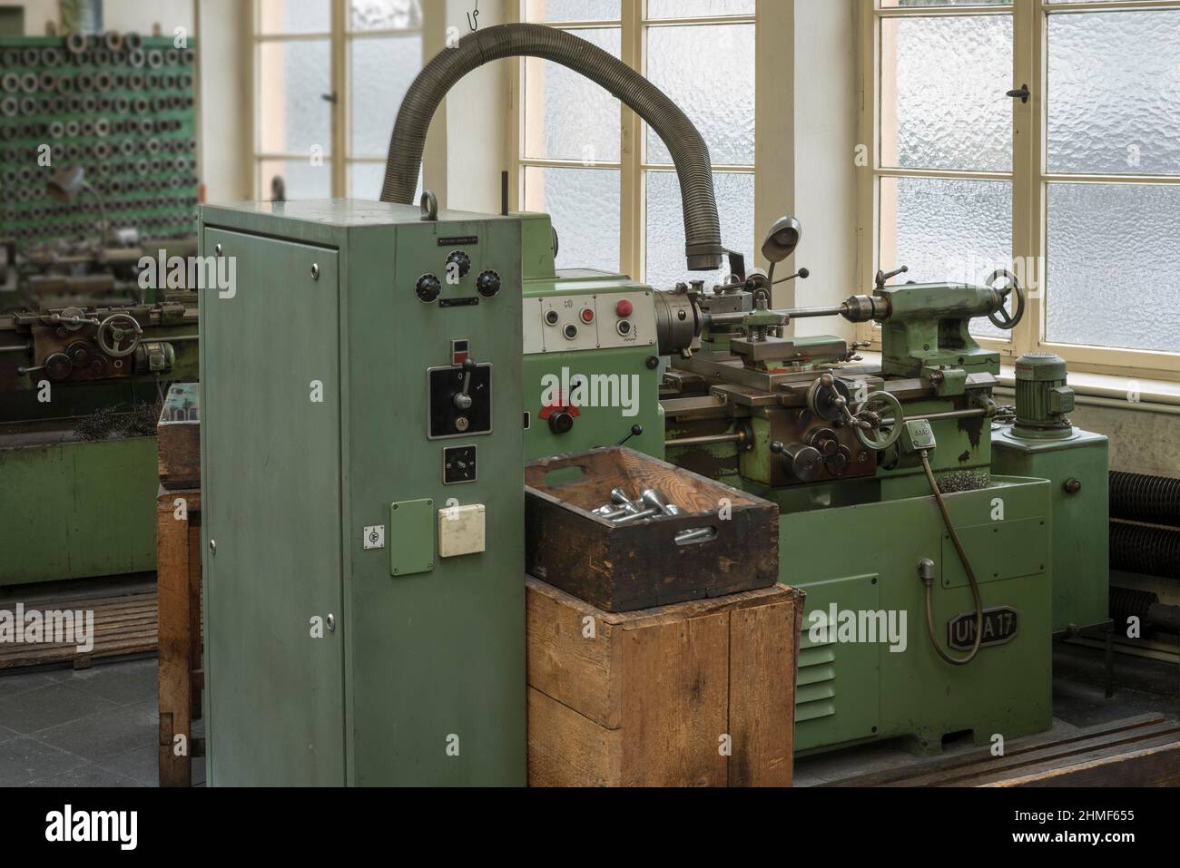Lathe with extraction system in a historic valve factory, now an industrial museum, Lauf an der Pegnitz, Middle Franconia, Bavaria, Germany Stock Photo