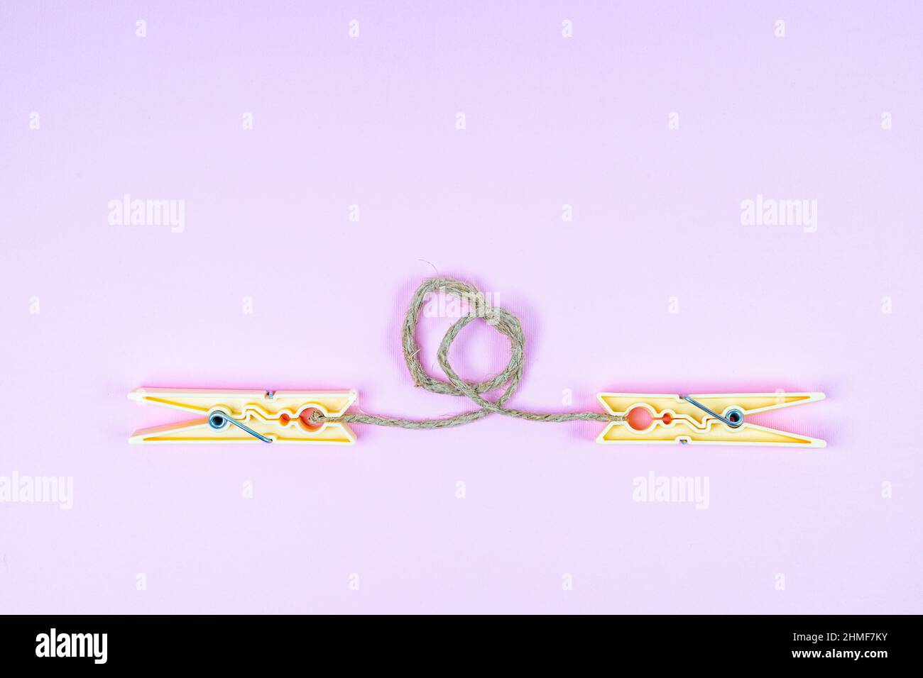 the connection with a string between two clothespins Stock Photo Alamy