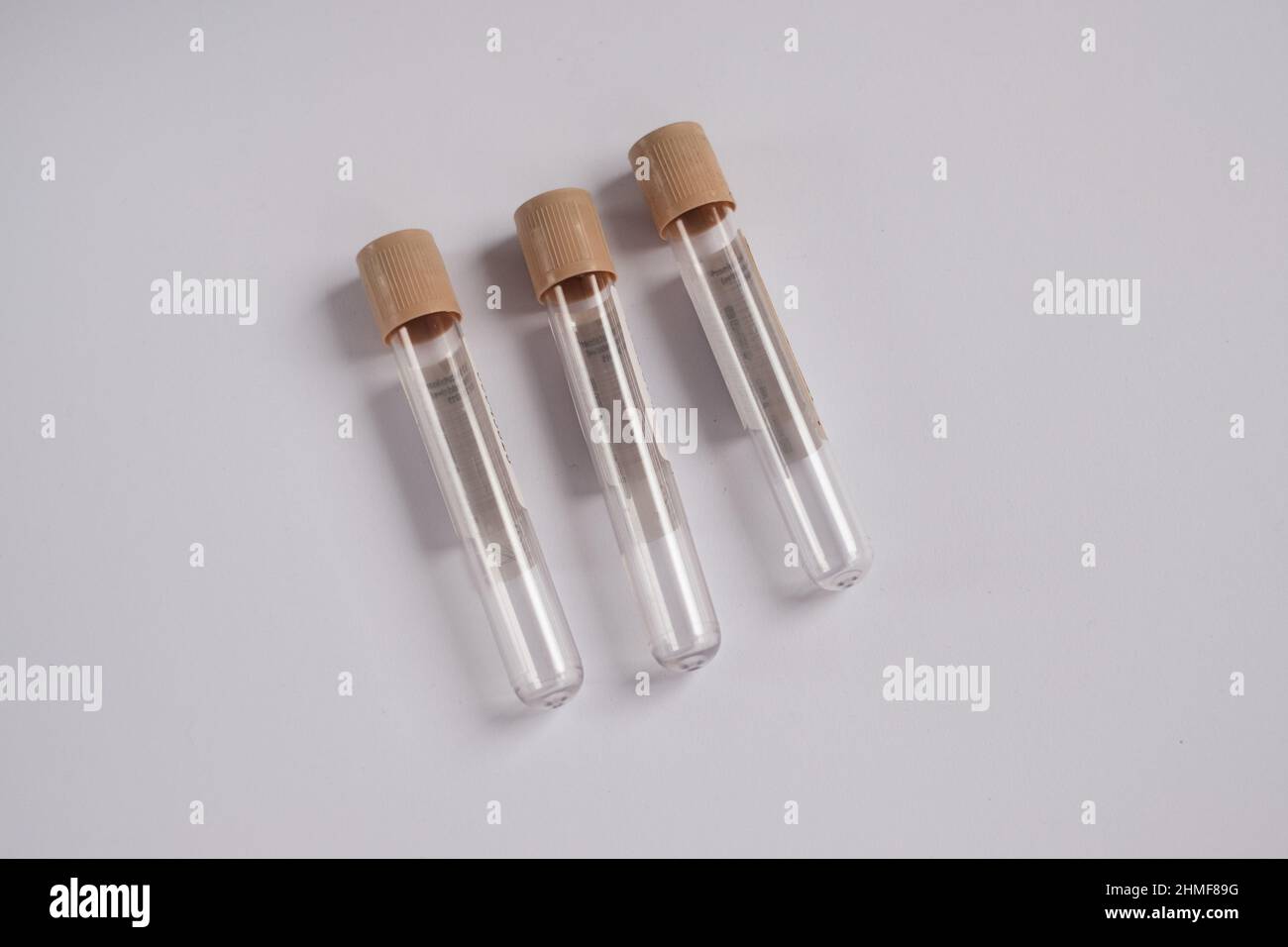 Blood collection tubes with brown caps. Medical treatment and pharmacy concept. Stock Photo