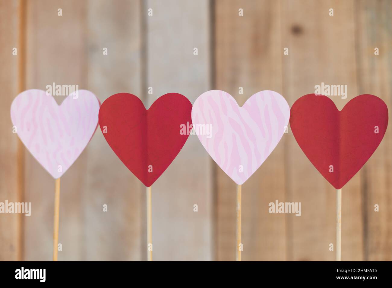 hearts of red and pink colors on wooden background, valentine's day Stock Photo