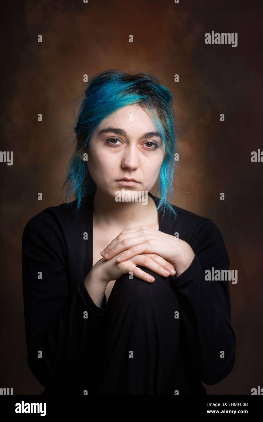photo of young woman expressing melancholy, sadness, reflection Stock Photo